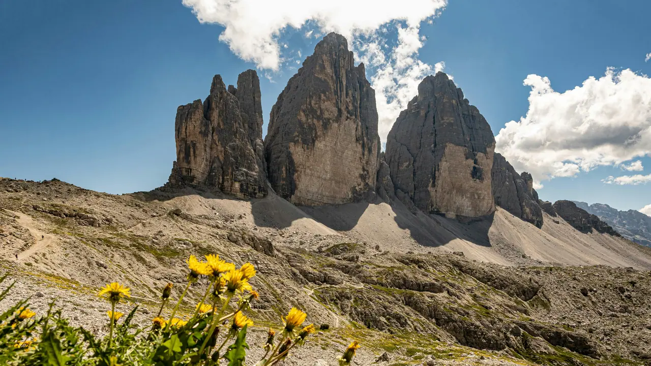 Breathtaking view of the iconic Tre Cime di Lavaredo in sunny Trentino-South Tyrol.